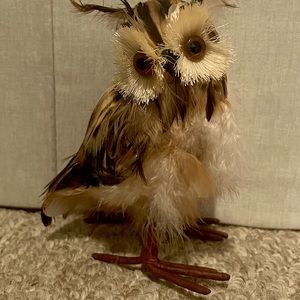 Small, feathered owl replica
